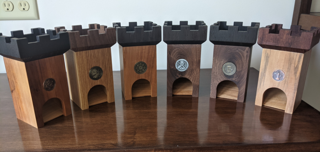 Six completed dice towers