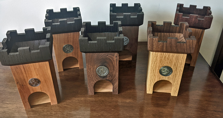 Six completed dice towers