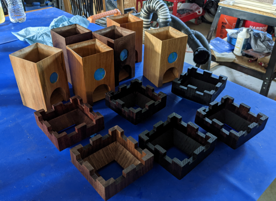 Six unassembled dice towers