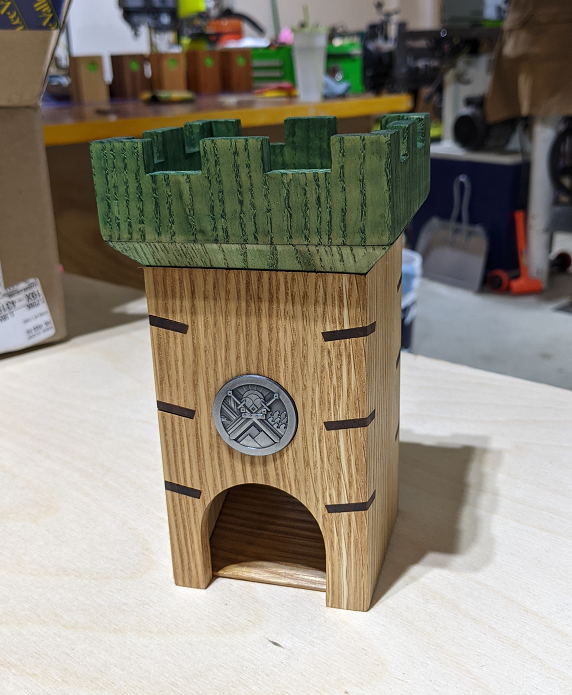 Ranger dice tower - white oak with a dyed green battlement. Brown splines on the corners to simulate stitching.